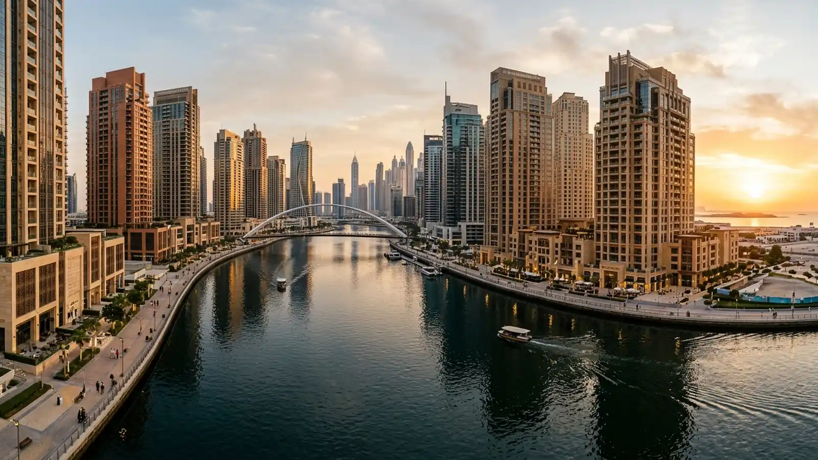 Business Bay canal and Downtown Dubai residential corridor at golden hour dusk